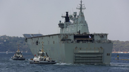 HMAS Adelaide loads supplies and departs Sydney, Garden Island in Sydney on January 04, 2020. Picture: Gaye Gerard